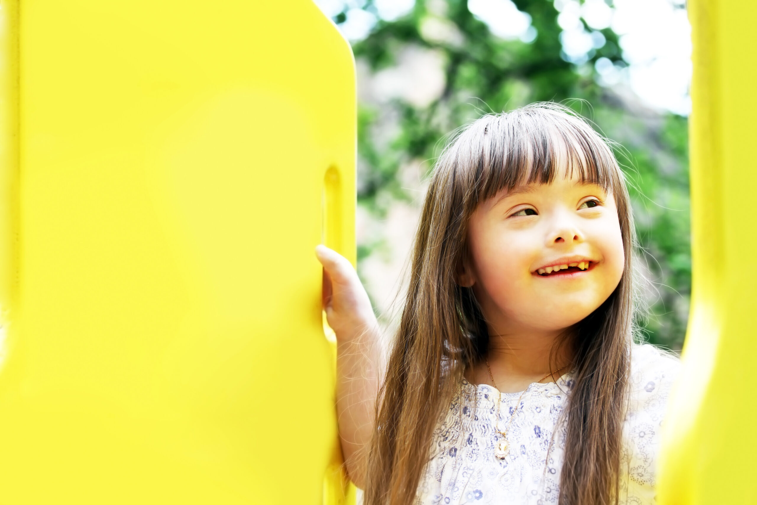 Portrait of beautiful young girl on the playground.